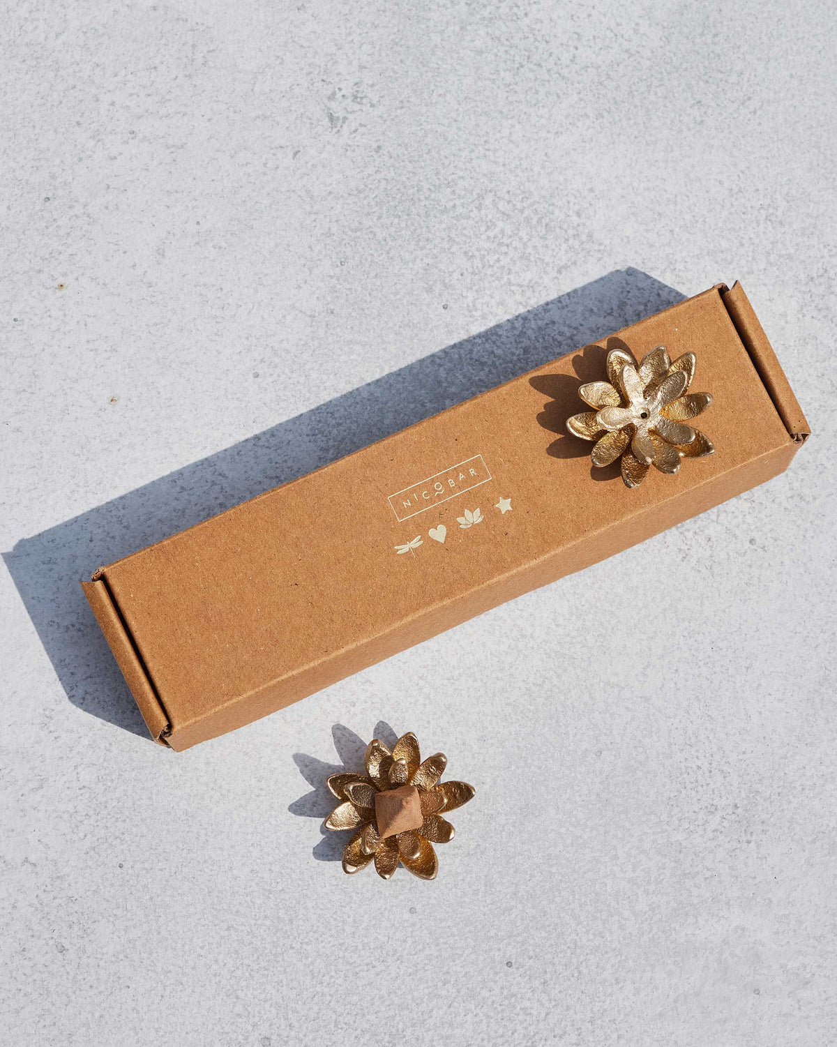 Kamal incense holders with Nerola cone beside their Nicobar gift box.