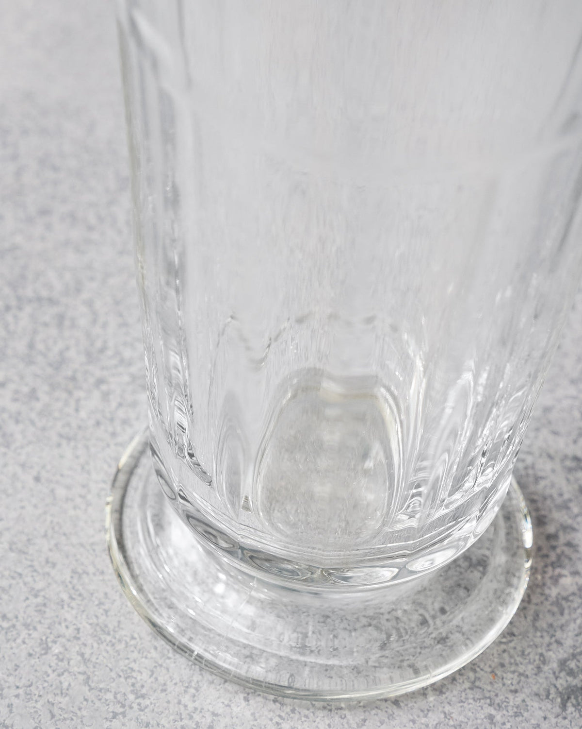 Close-up of Mahi beer glass ribs meeting its circular footed base.
