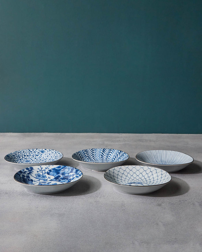 Set of five Donburi shallow bowls with mixed blue floral and geometric prints.