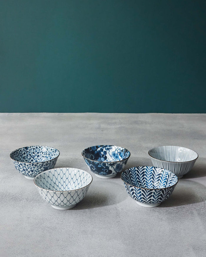 Set of five blue and white Aiiro snack bowls with mixed patterns.