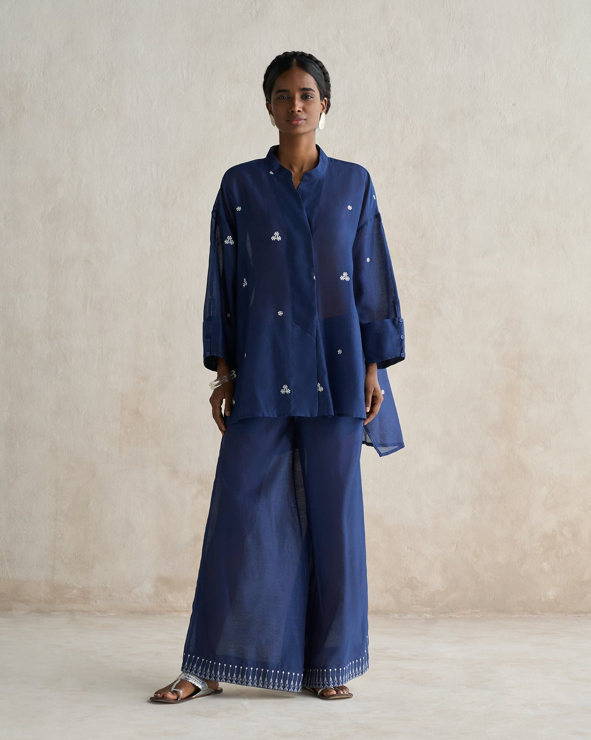 Full-length view of a blue Cirrus Shirt worn by a person.