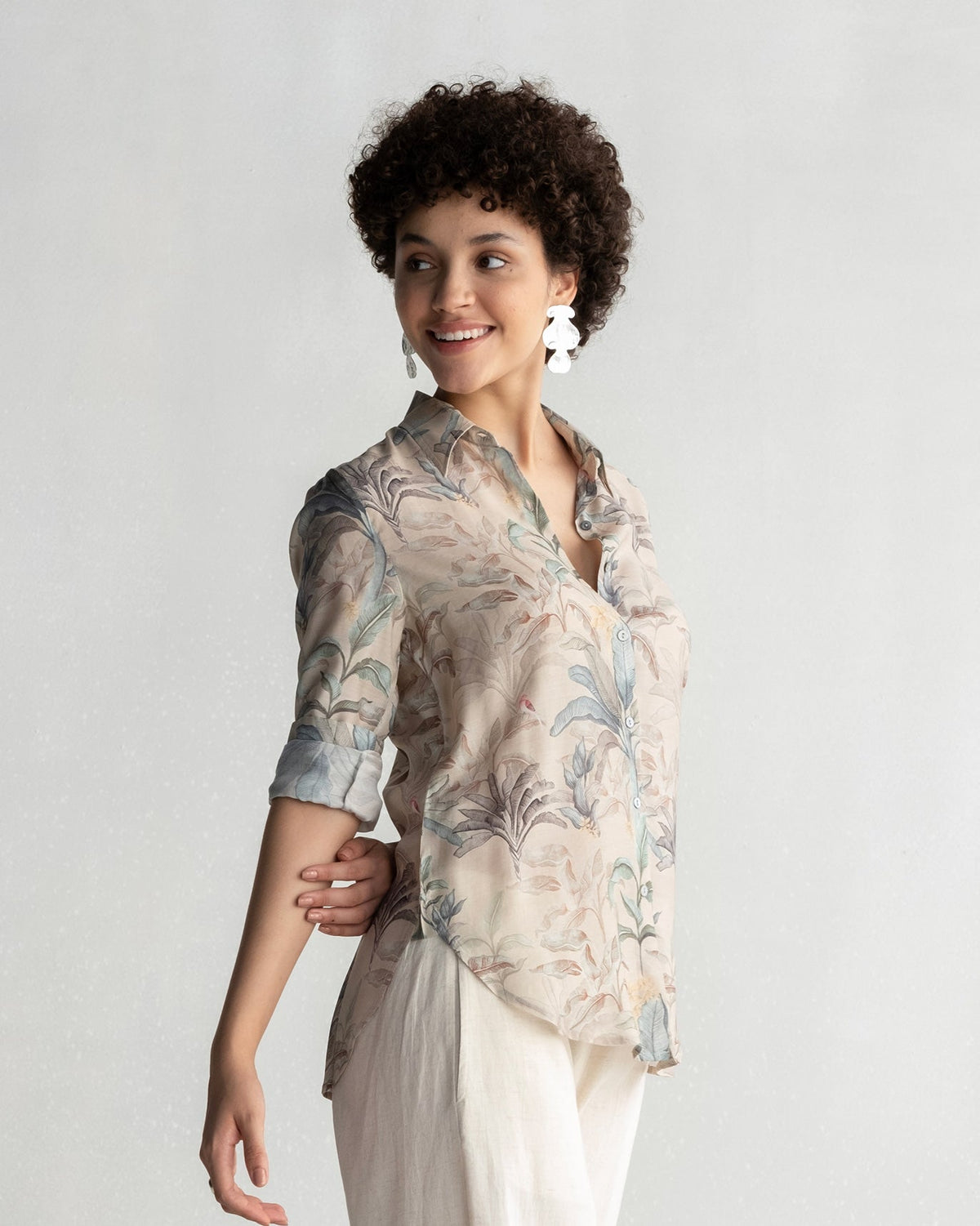 Side view of a Tropico Shirt with rolled sleeves worn by a person.