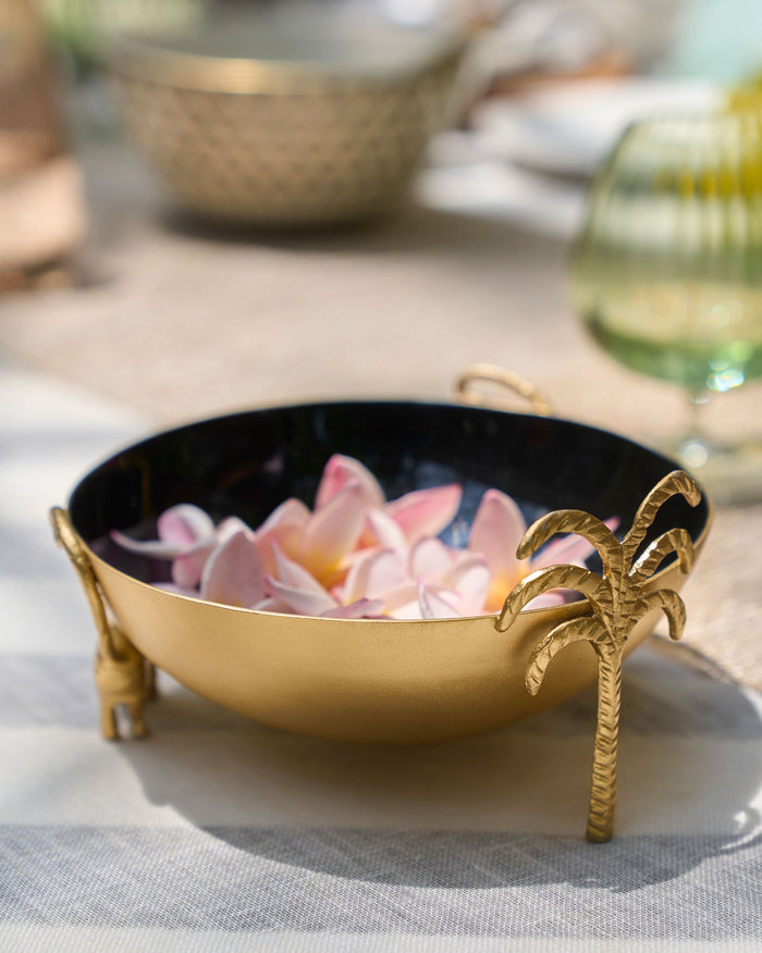 Brolly Deco Bowl with pink petals inside and a palm-tree foot.