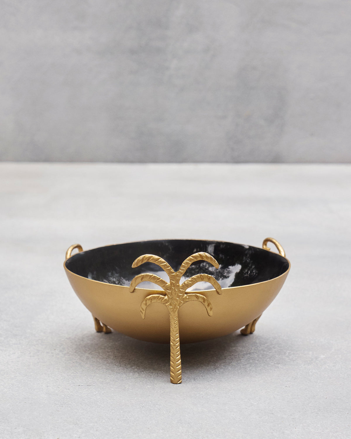 Side view of the Brolly Deco Bowl with a gold palm-tree foot.