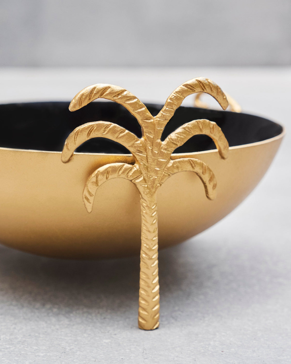 Close-up of the Brolly Deco Bowl palm-tree foot and fronds.