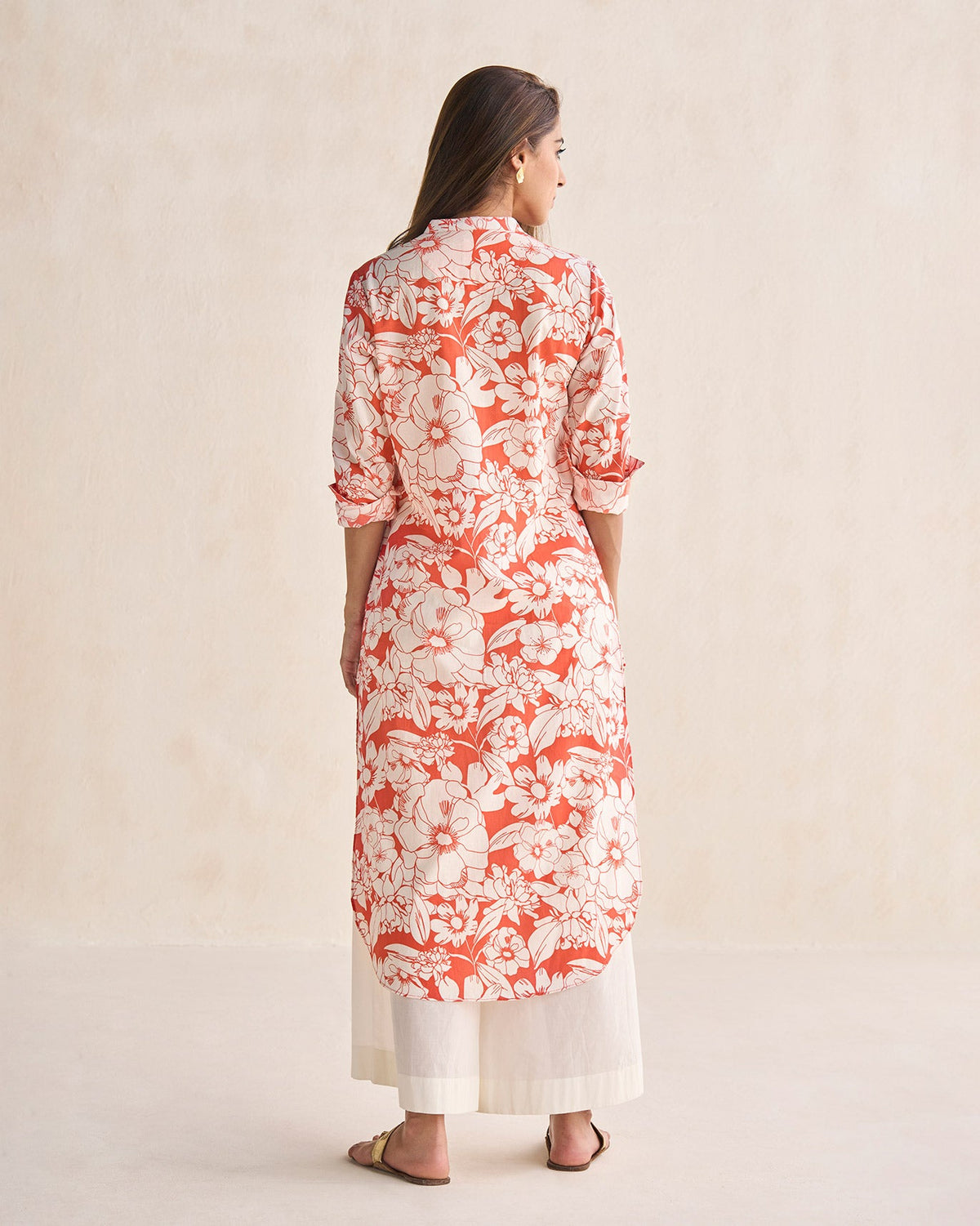 Back of the coral and ivory Basic long length kurta worn by a person.