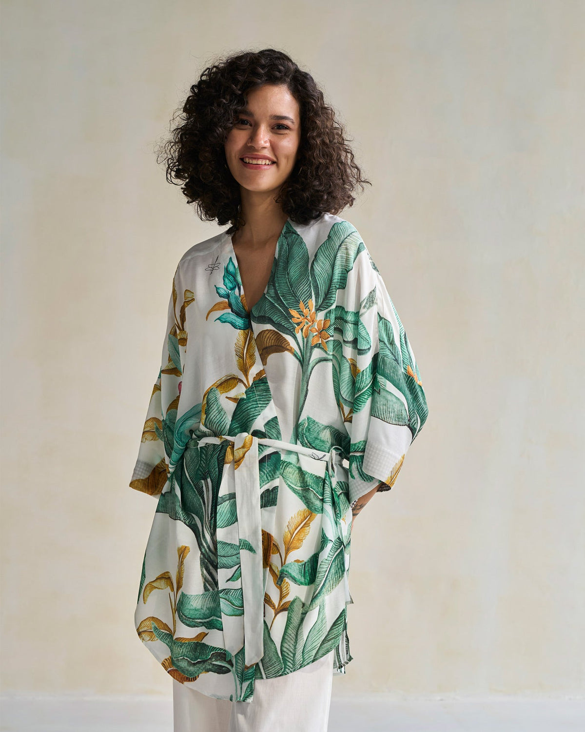 Person wearing a Celeste Kimono tied at the waist with a belt.