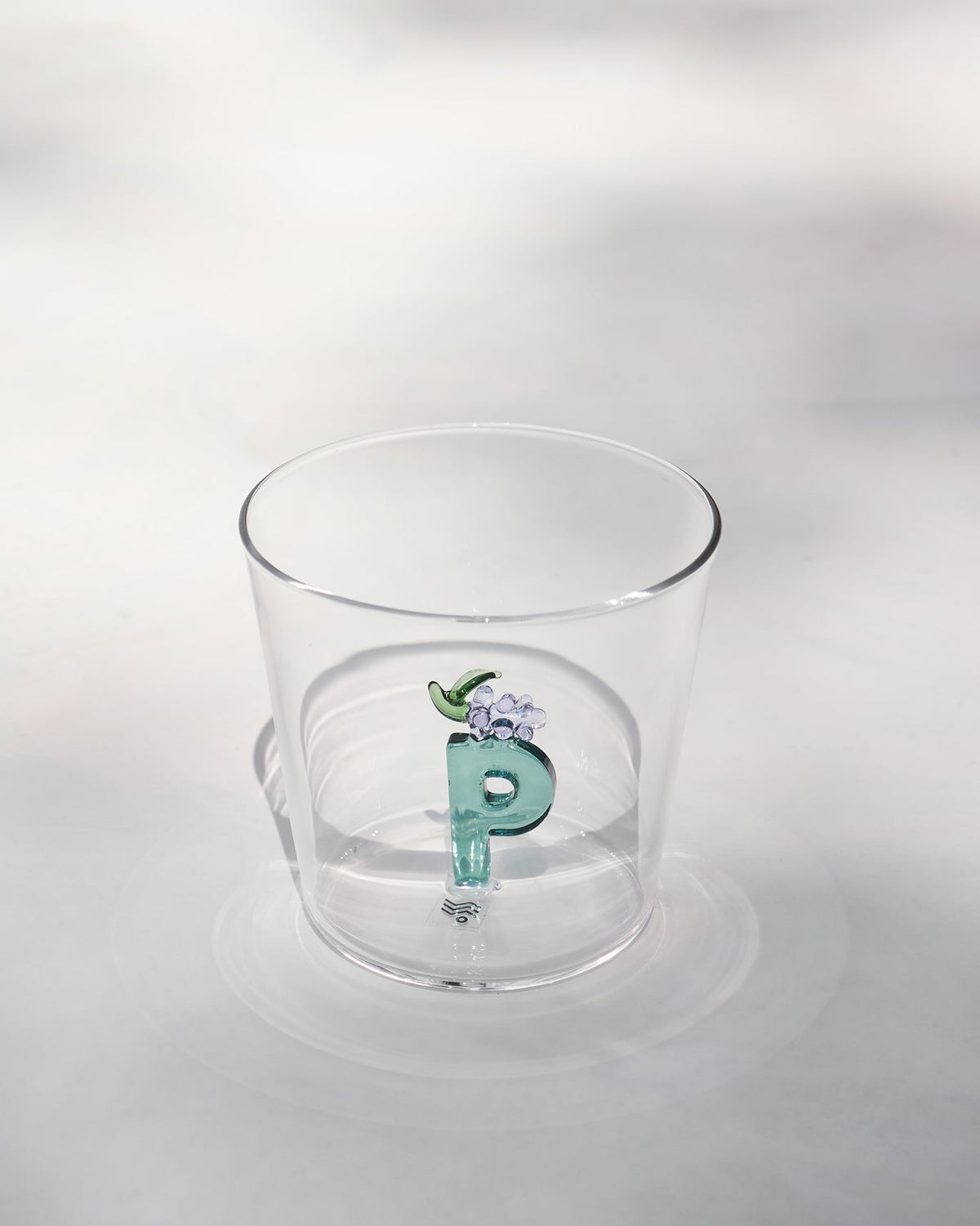 Clear Alphabet Glass P with a teal glass letter P and purple flower.