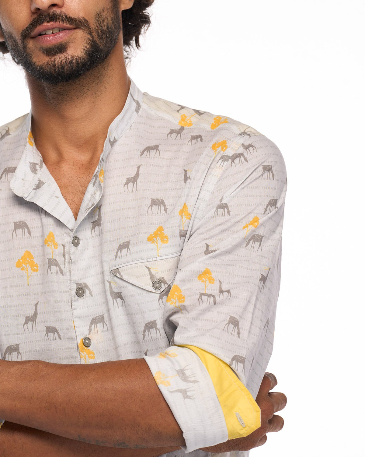 Close-up of the chest pocket on a Fort Kurta in grey animal print with yellow-lined cuffs.