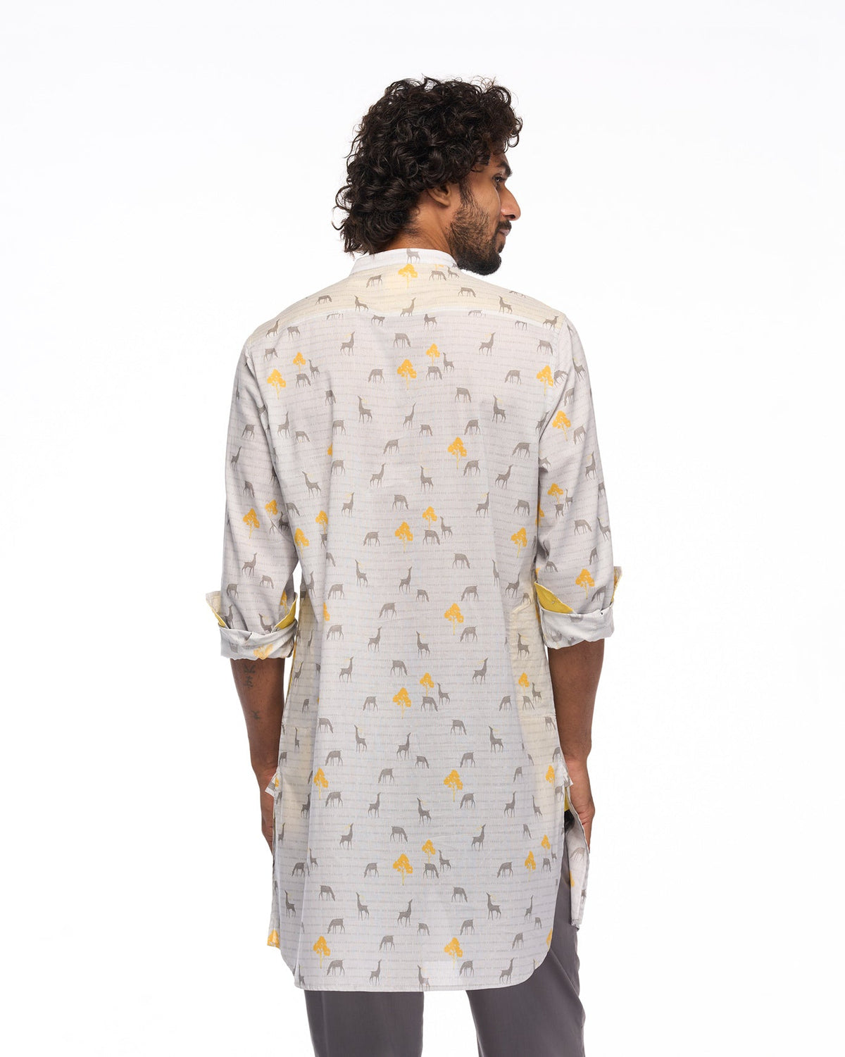 Back of a Fort Kurta in grey animal and yellow tree print worn by a person.