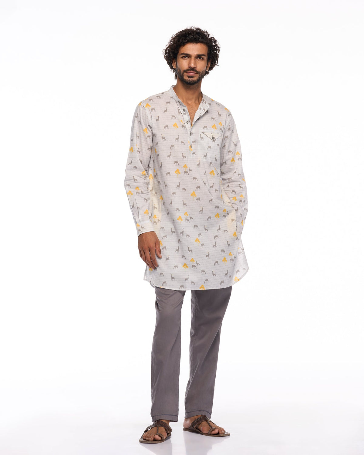 Full-length view of a Fort Kurta in grey animal and yellow tree print worn by a person.