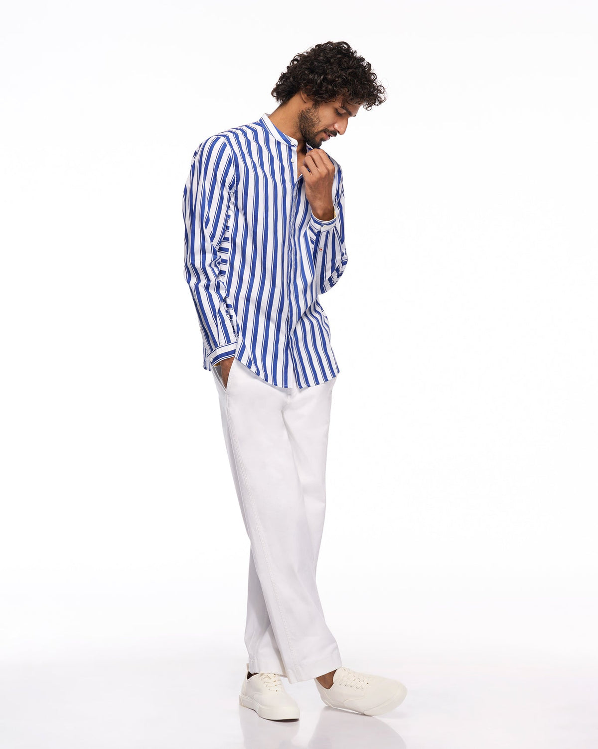 Full-length view of white Sand Pants worn by a person.