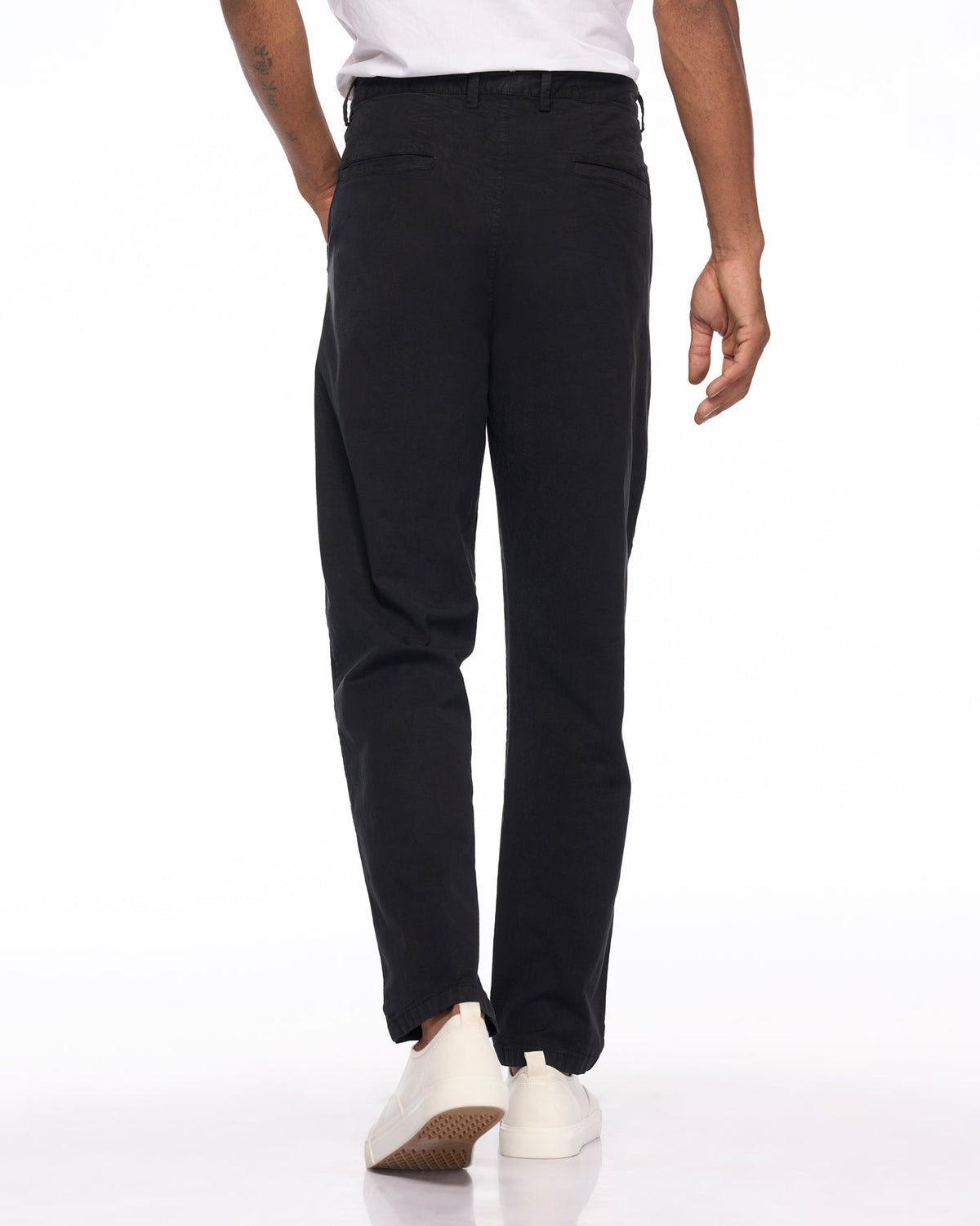 Back of black Azure Trousers worn by a person.