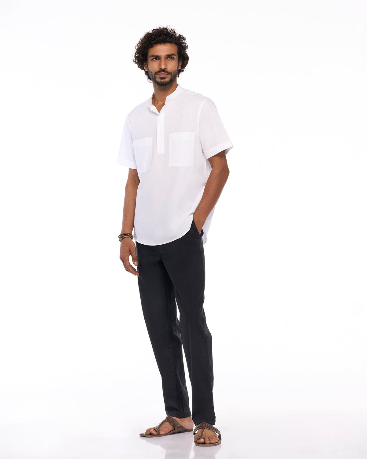 Full-length view of black Azure Trousers worn by a person.