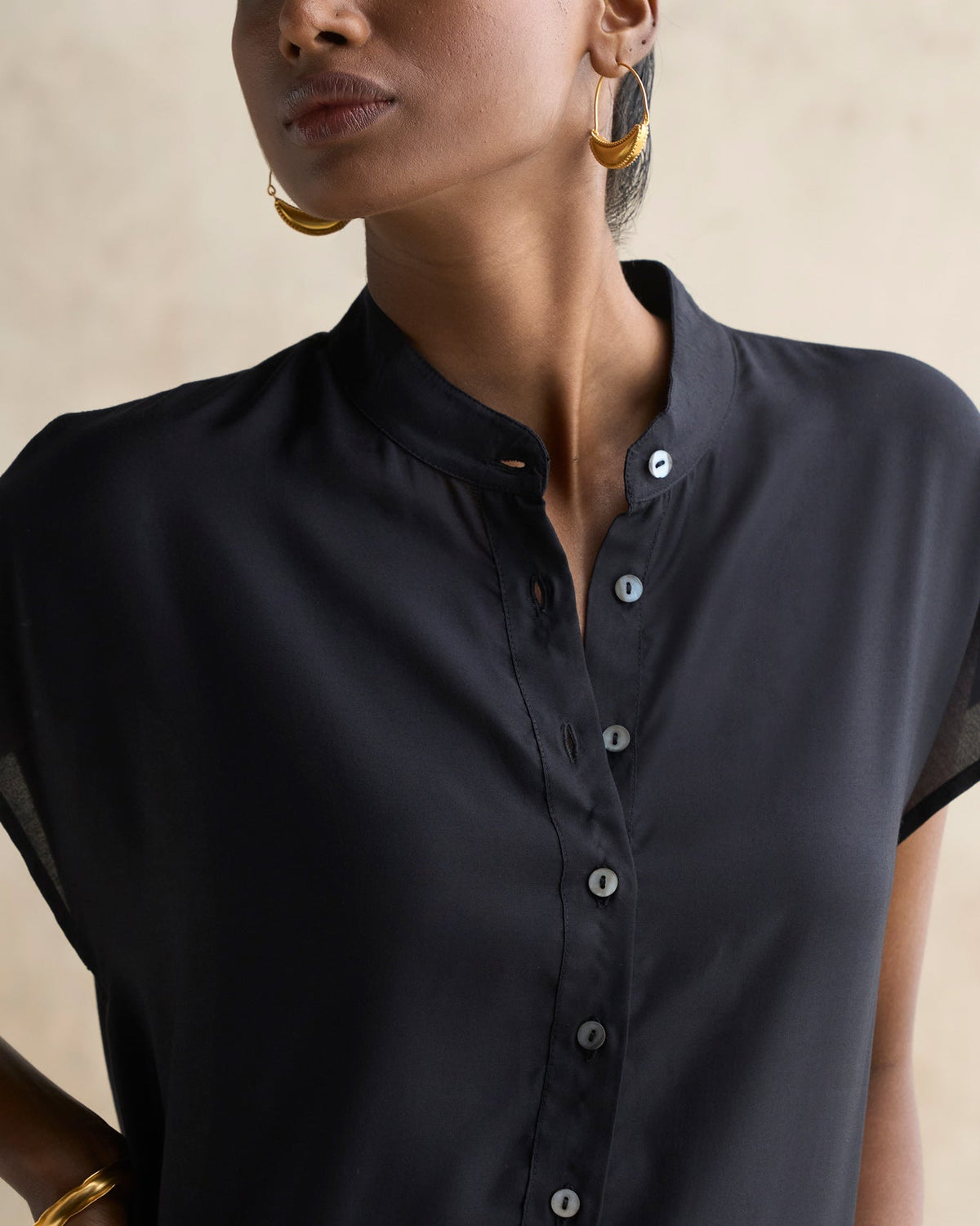 Close-up of a black Short Sleeve Kurta showing its mandarin collar and button placket.