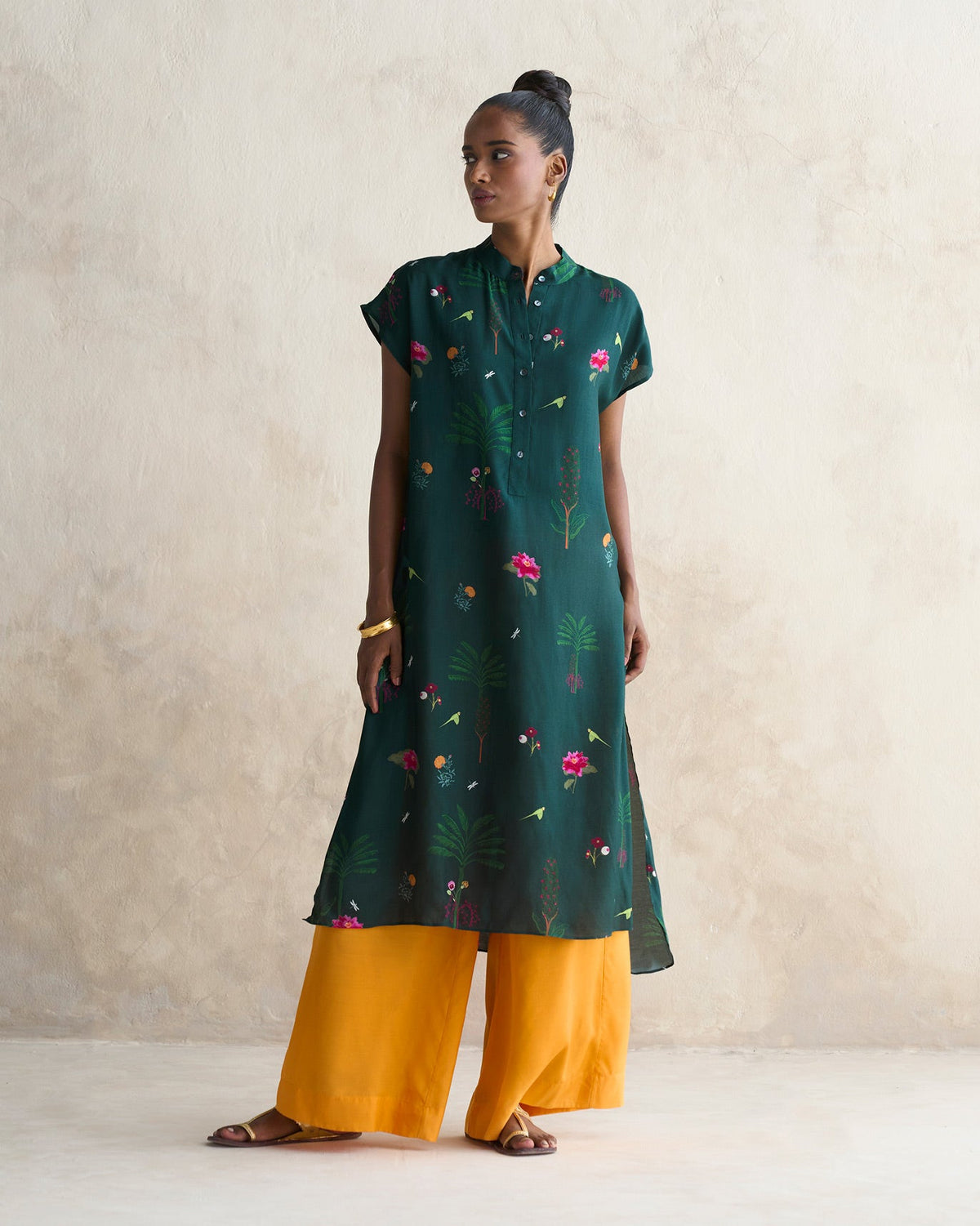 Full-length view of tangerine Basic Pyjamas worn by a person.