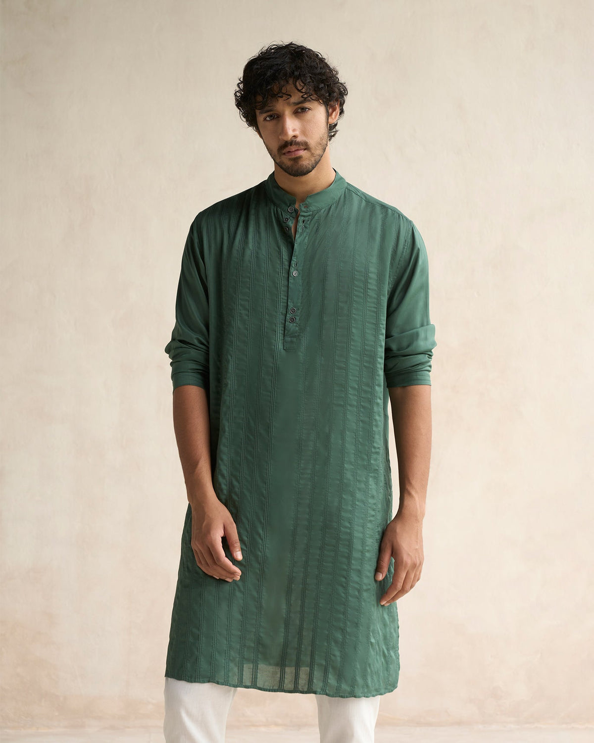 Person wearing a deep green Long Pleated Kurta with a band collar.