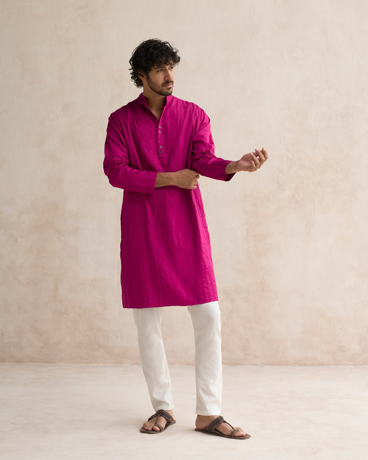 Person wearing a deep pink Long Pleated Kurta with a band collar.