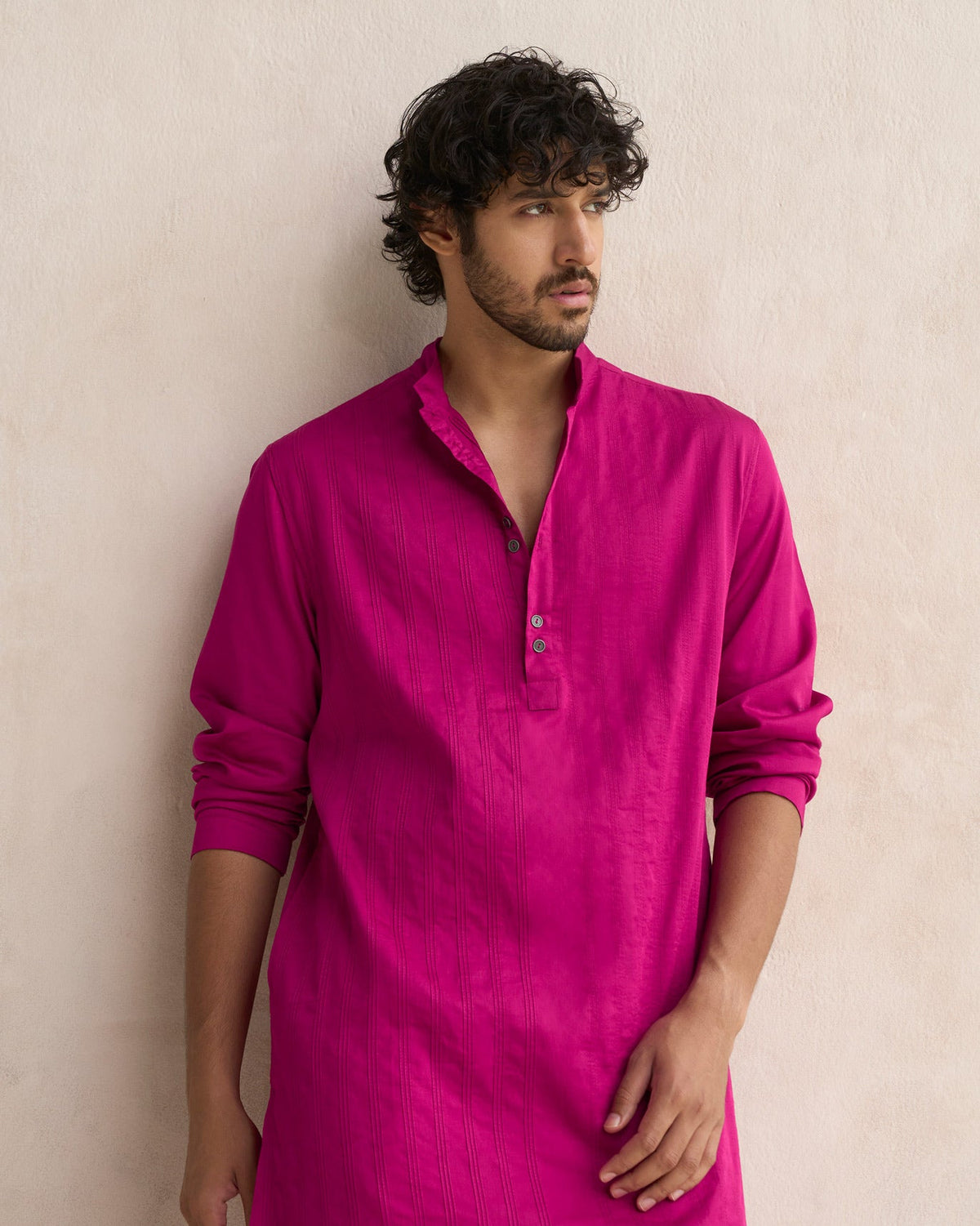Half-length view of a deep pink Long Pleated Kurta showing vertical pleats and placket buttons.