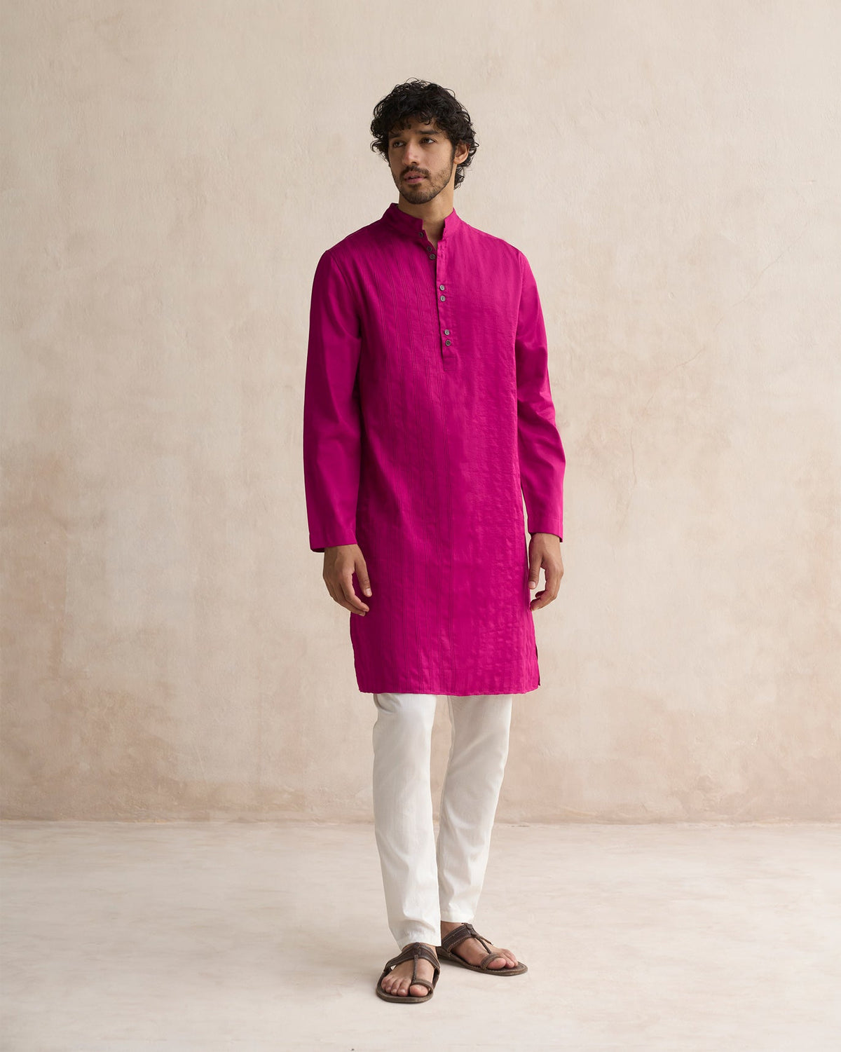 Full-length view of a deep pink Long Pleated Kurta worn by a person.