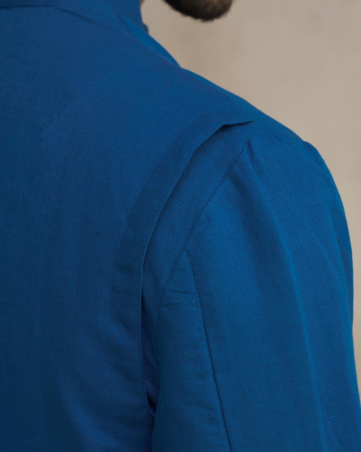 Close-up of the shoulder and back of a sapphire Negombo Bandhgala.