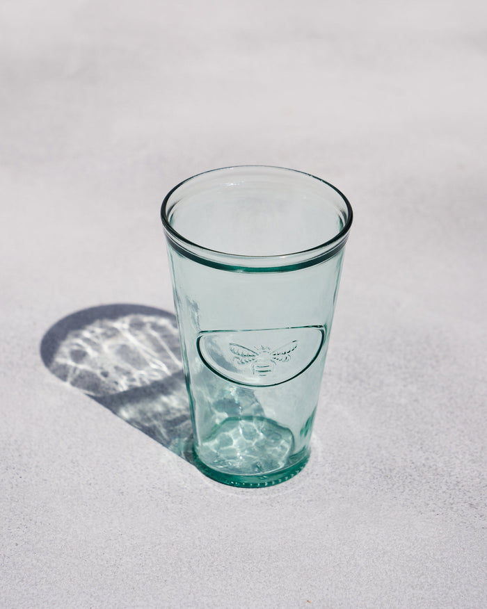 Firefly Beer Glass in clear green-tinted glass with an embossed insect.