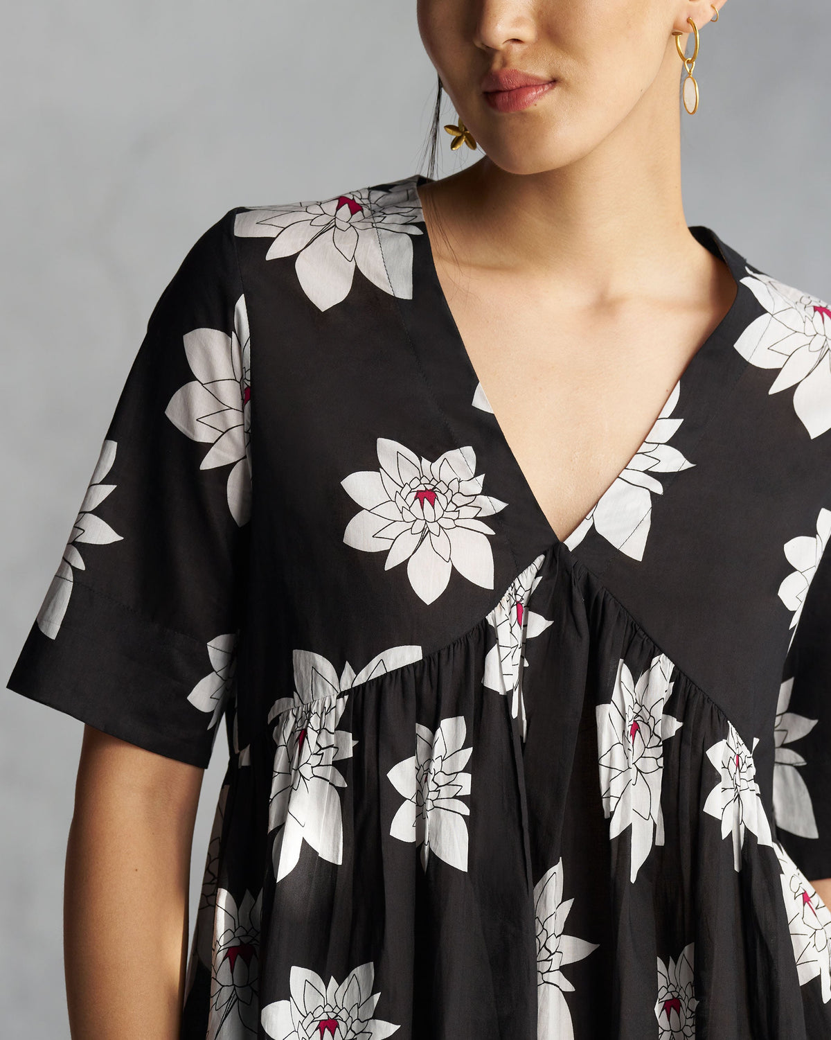 Close-up of the V-Neck Gathered Kurta neckline showing white flowers with pink centres.