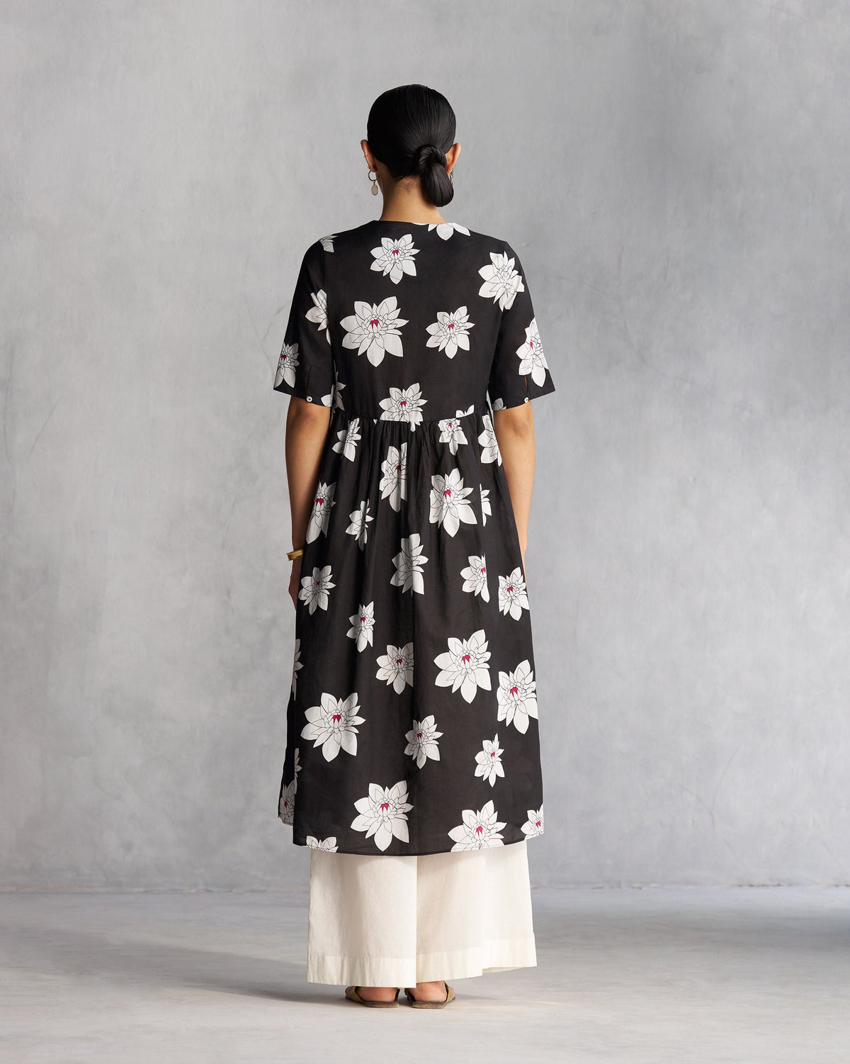 Back of a black V-Neck Gathered Kurta worn by a person.