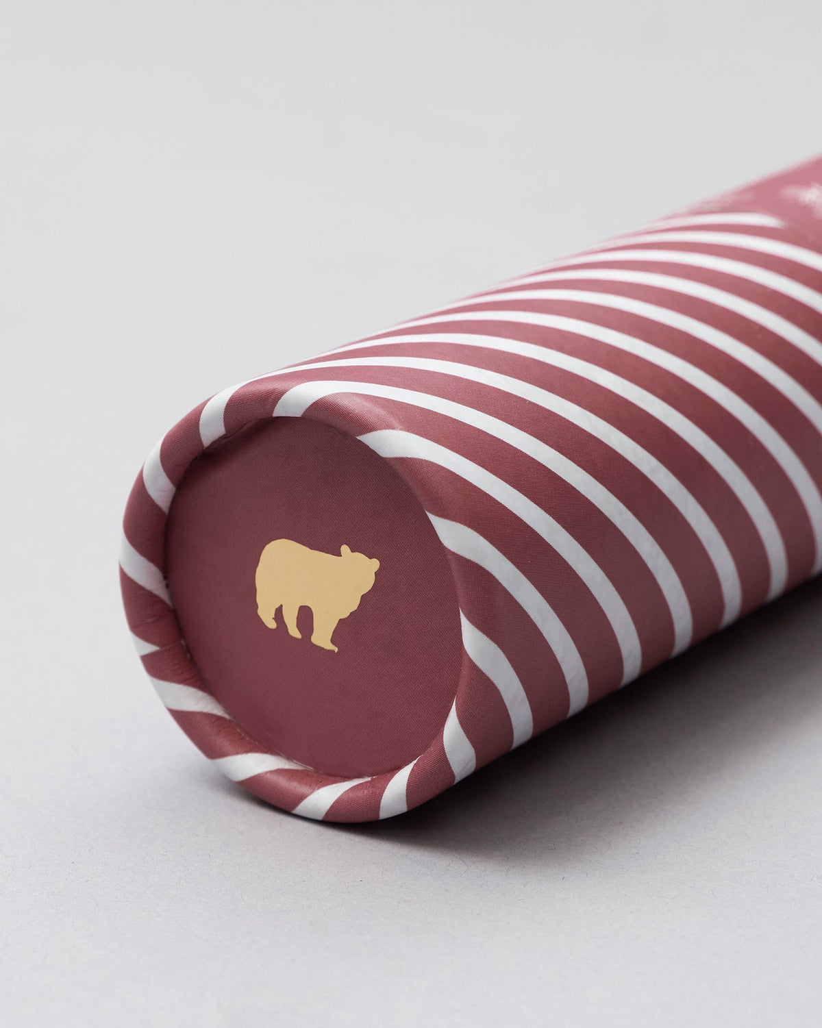 Close-up of Kandha tube packaging with gold bear logo.