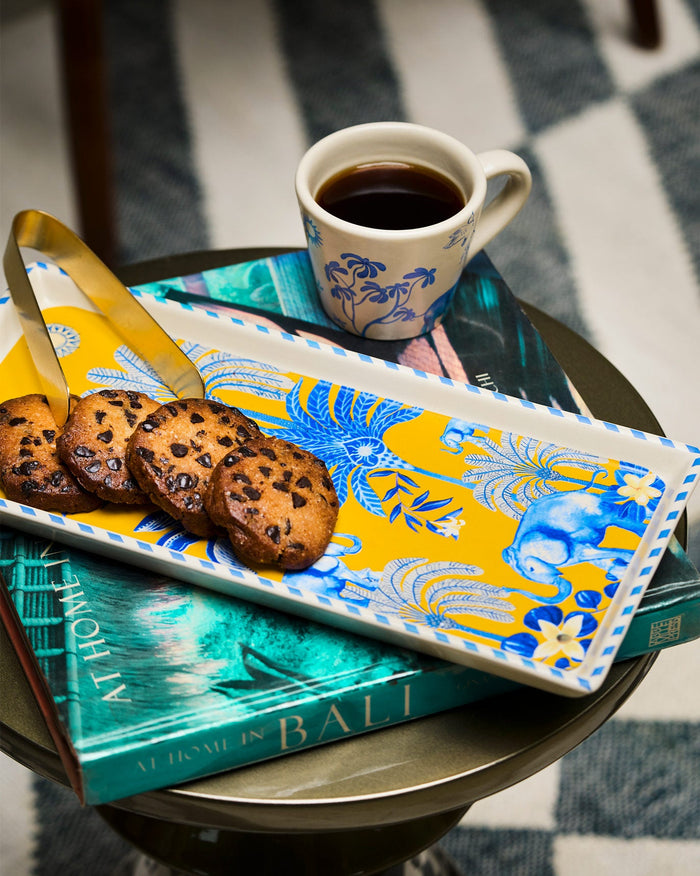 Alam Cookie Tray with Tong holding cookies beside a gold tong.