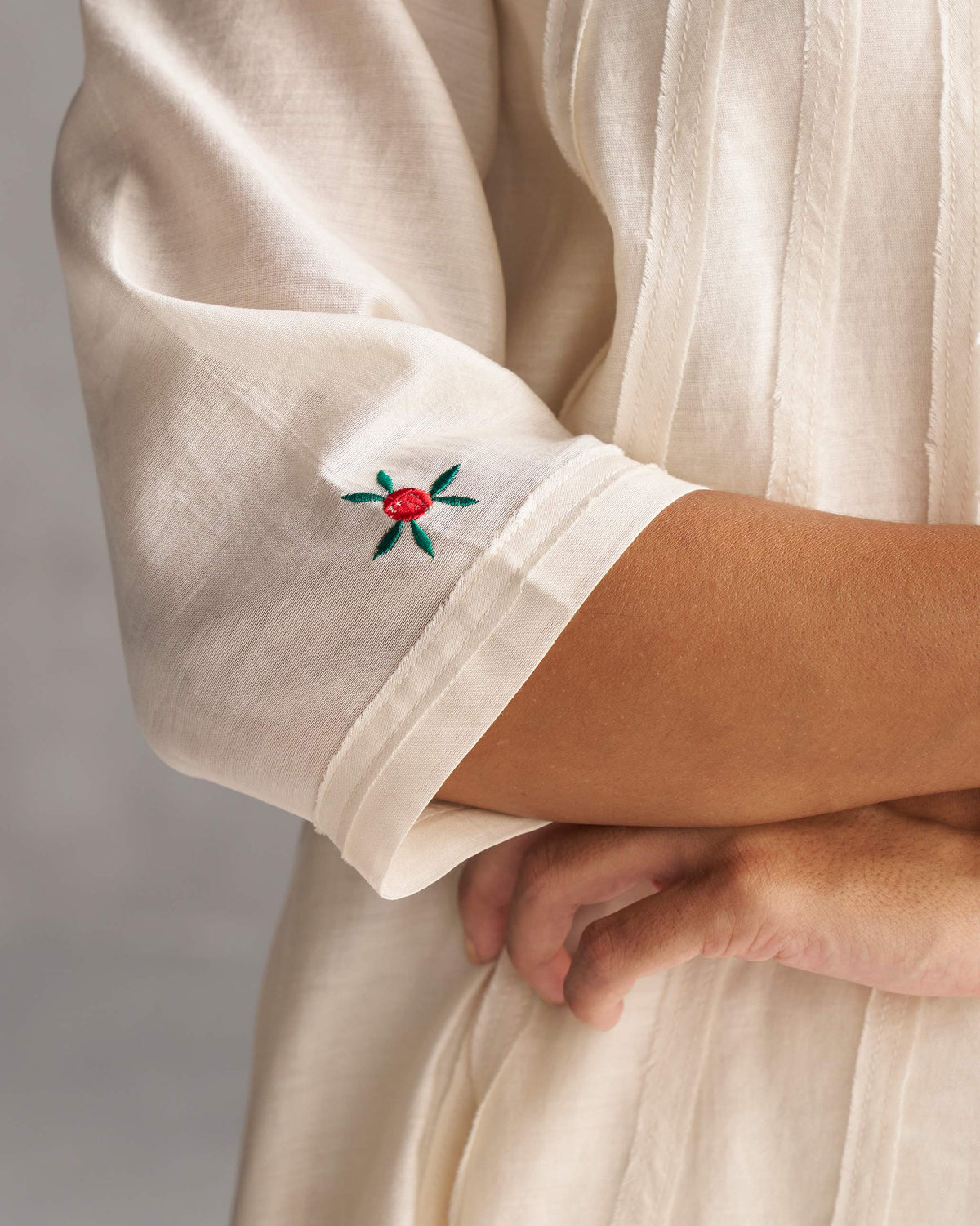 Close-up of Pattaya Kurta with Slip showing a red and green flower embroidery on the cuff.