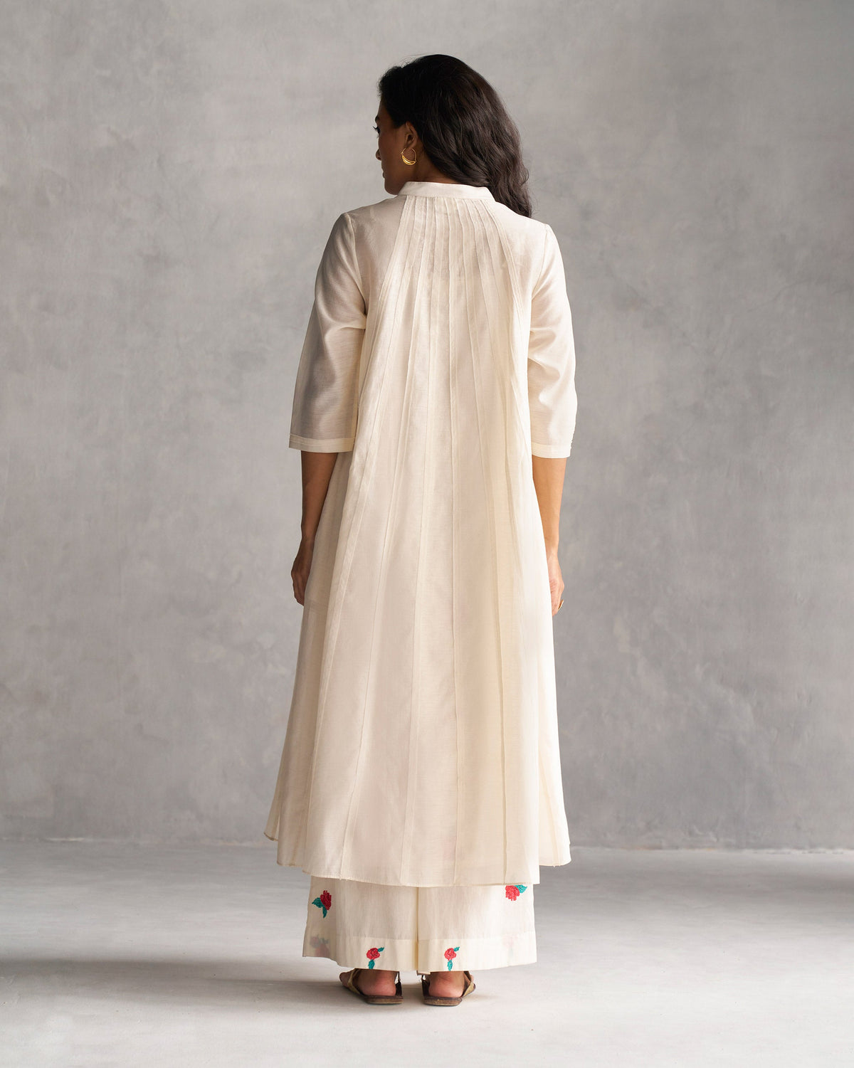 Back of Pattaya Kurta with Slip in ivory worn by a person.