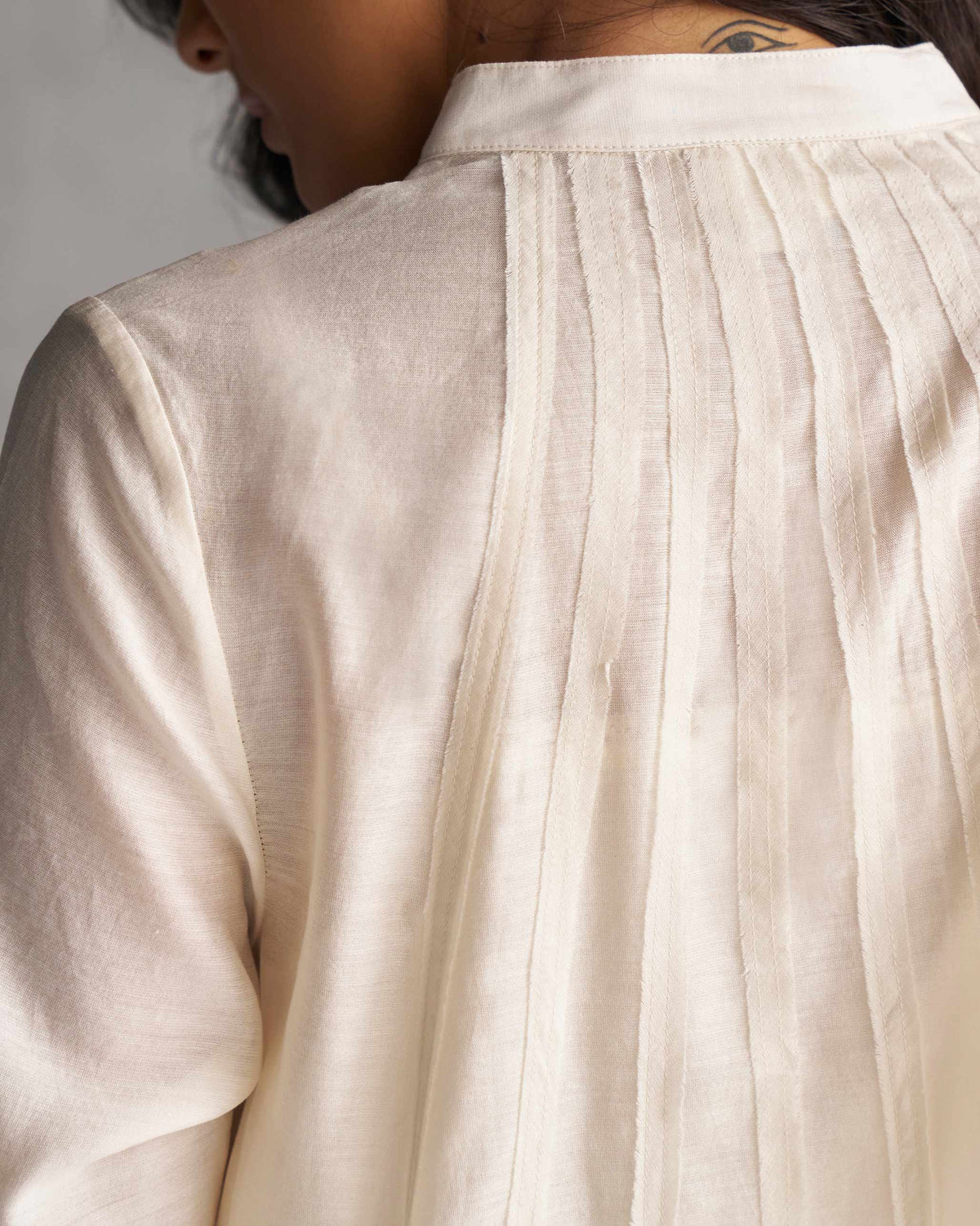 Close-up of Pattaya Kurta with Slip showing pin-tucks on the back yoke.