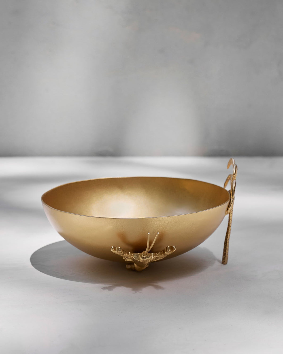 Side view of the Lobster Home Accent with its gold bowl and curved arm.