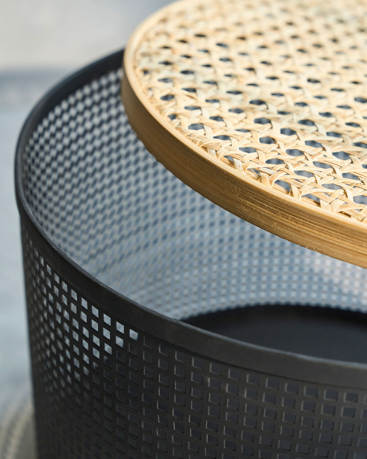 Close-up of the North Storage Basket lid and black perforated side.