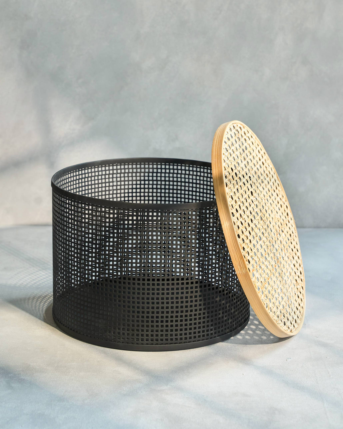 North Storage Basket open, with its woven lid leaning against the side.