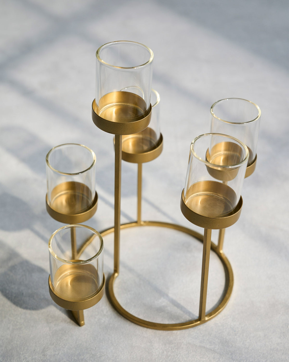 Float Votives gold ring stand with glass votive cups, viewed from above.
