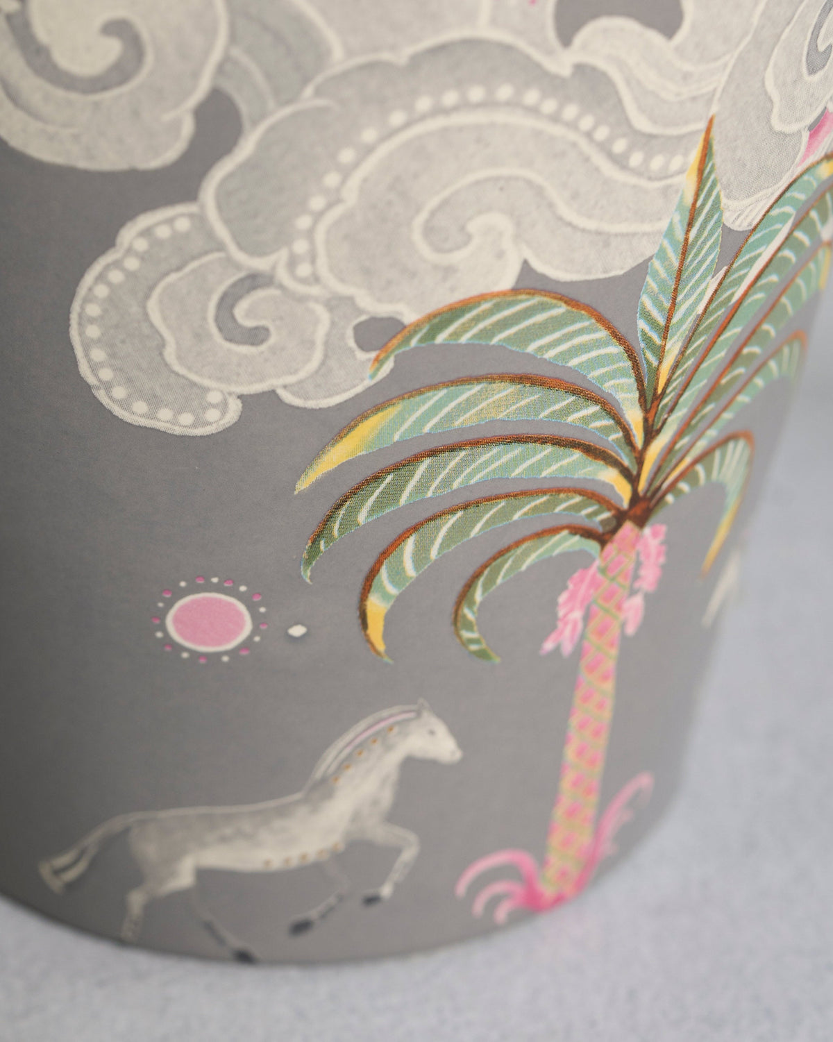 Close-up of Deco Palmette Vase showing a palm tree, clouds and a horse.