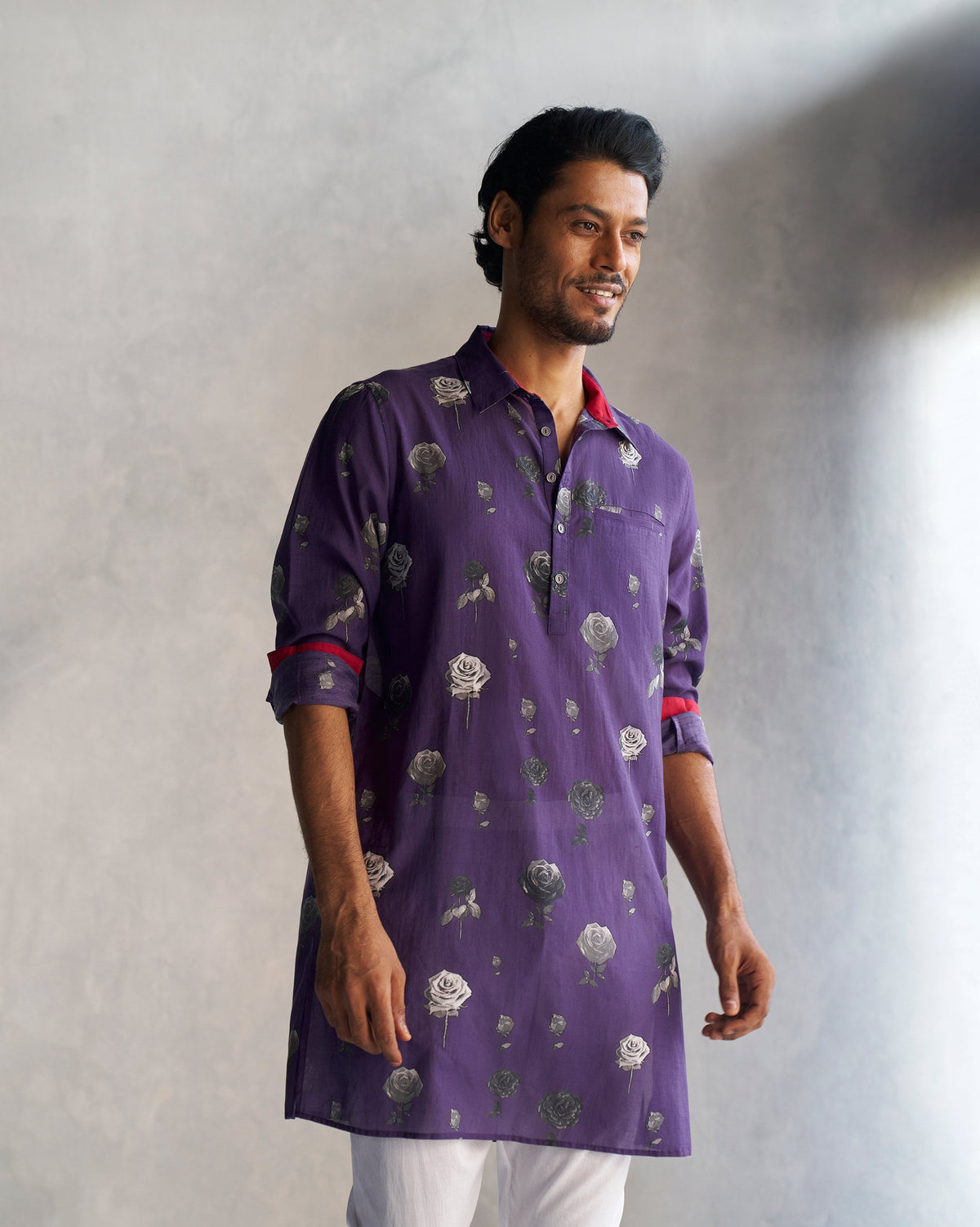 Person wearing a purple Bouquet Kurta with a rose print.