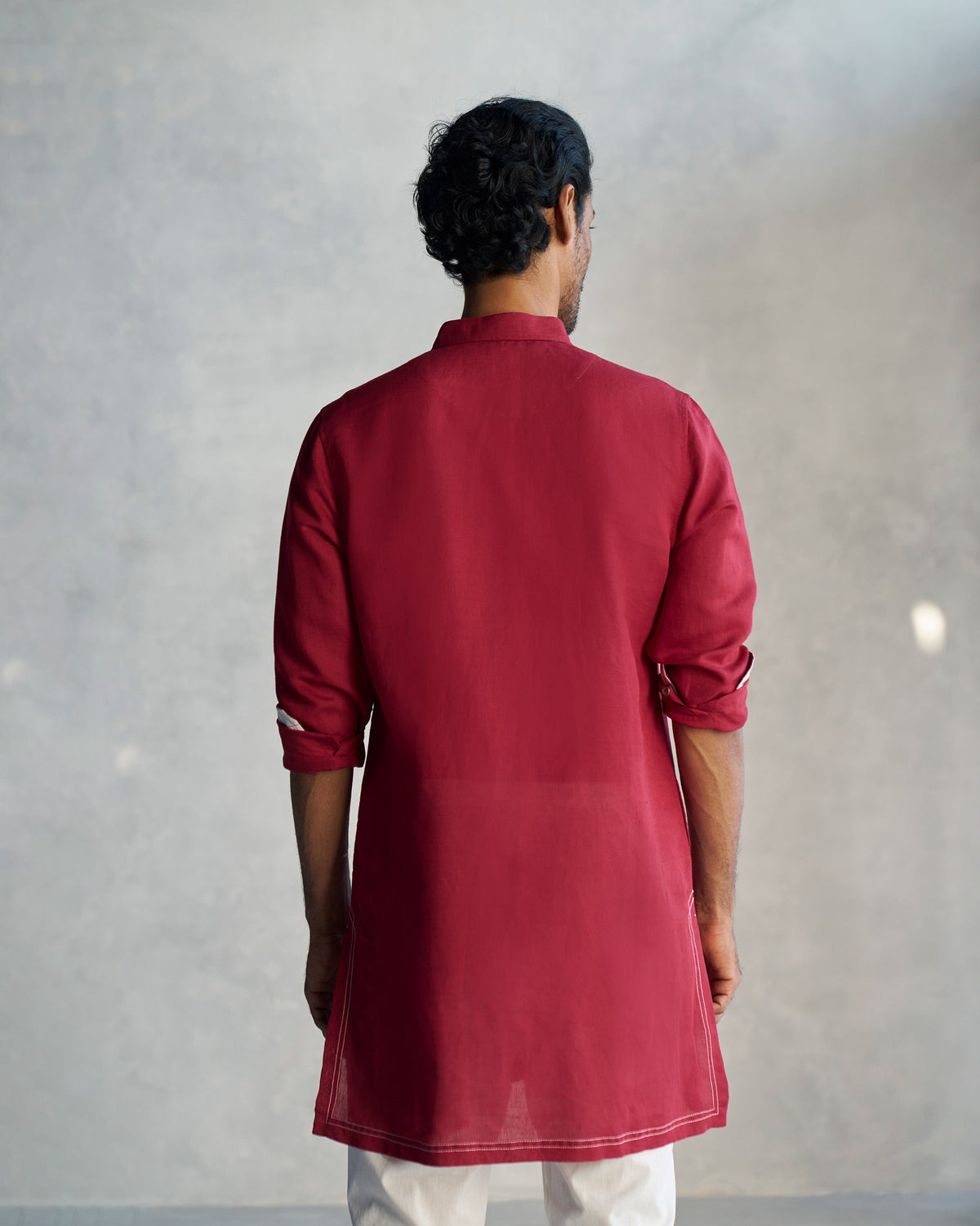 Back of a red Garnet Kurta worn by a person.