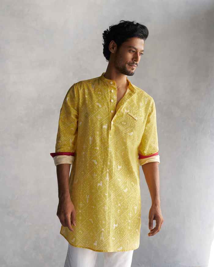 Person wearing the Fort kurta in yellow, with red-lined cuffs.