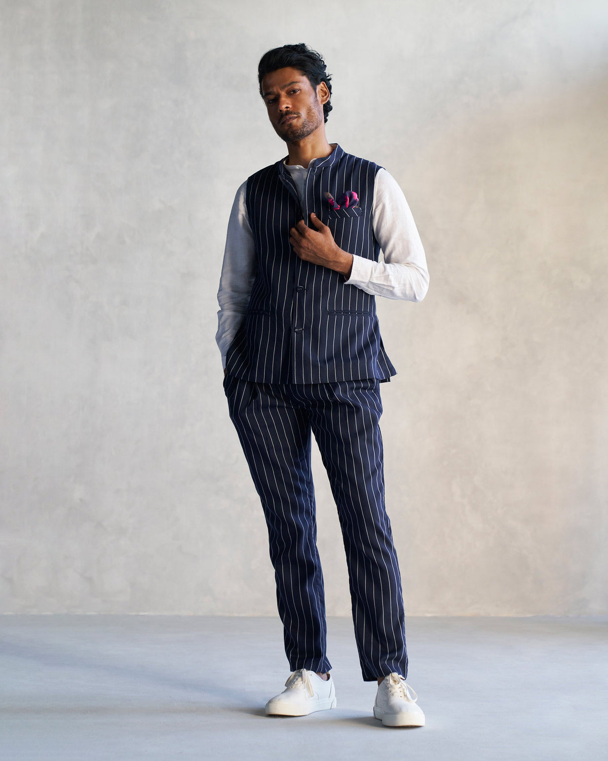 Navy pinstriped Banjara Trousers worn by a person, shown from head to foot.