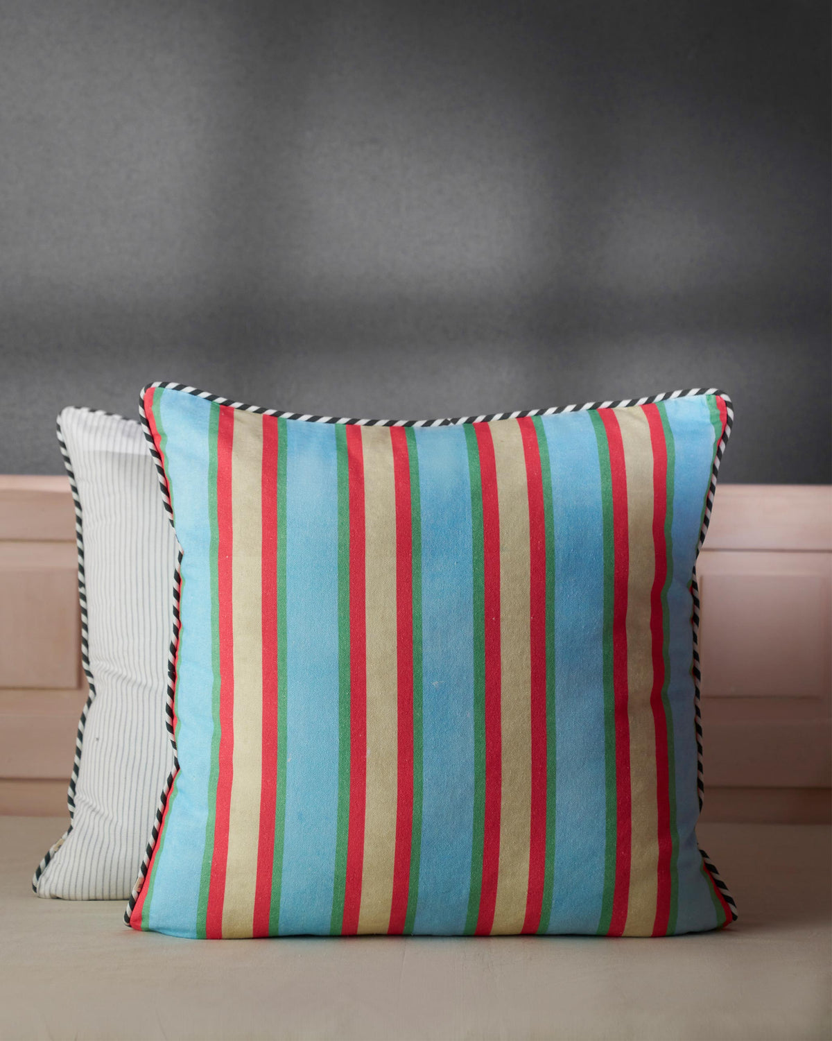 Sumatran Tiger Cushion Cover in blue with red, green and gold stripes.