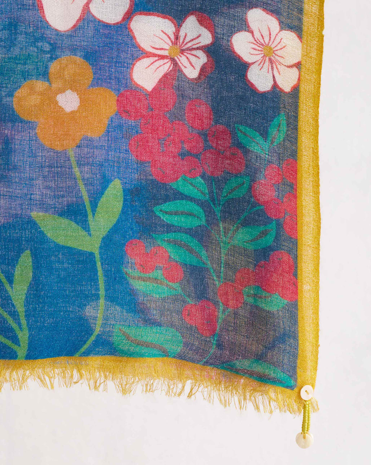 Close-up of Garden Shawl corner showing its flowers and yellow fringe.