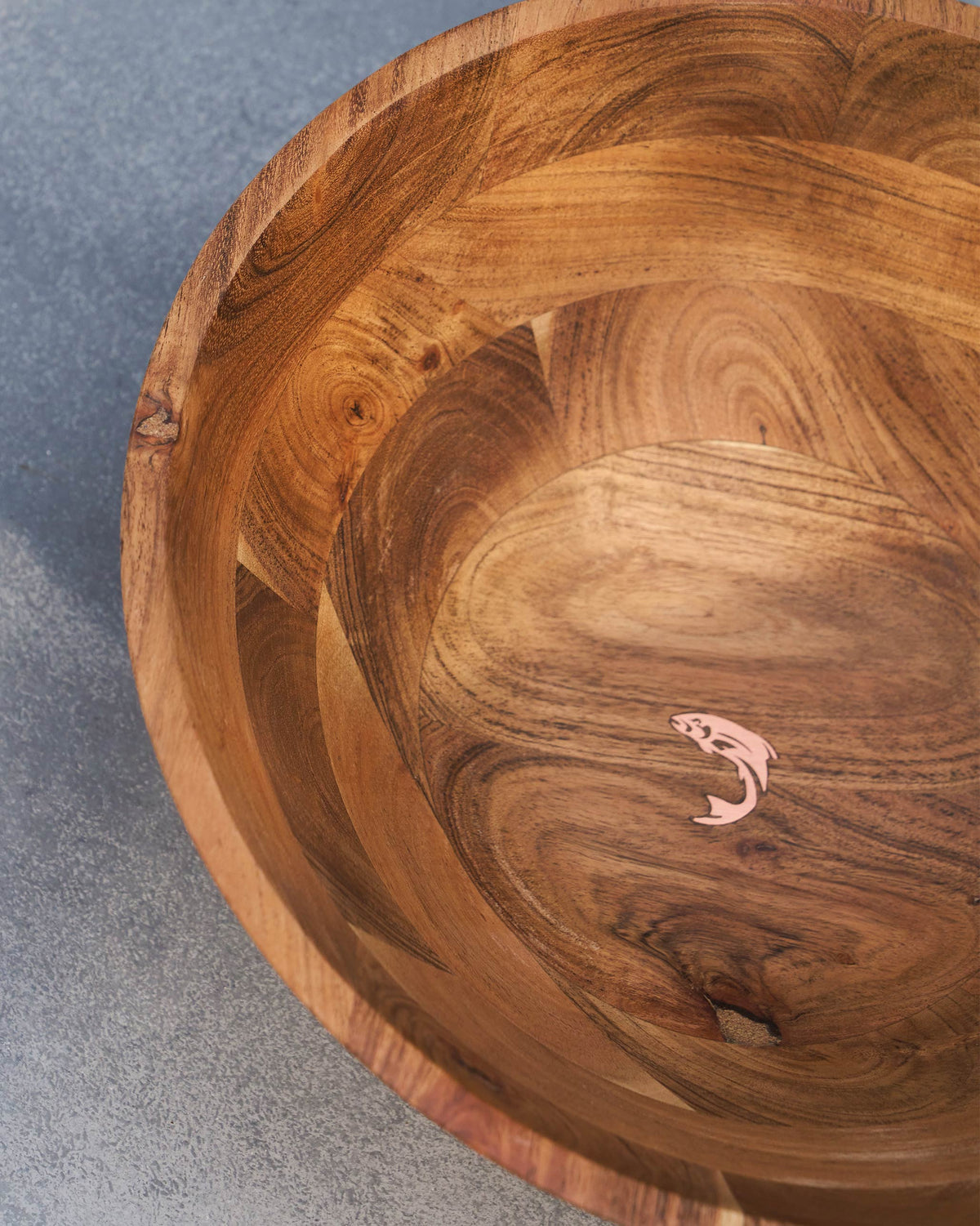 Close-up of Garden Salad Bowl interior with a copper-toned fish motif on the base.