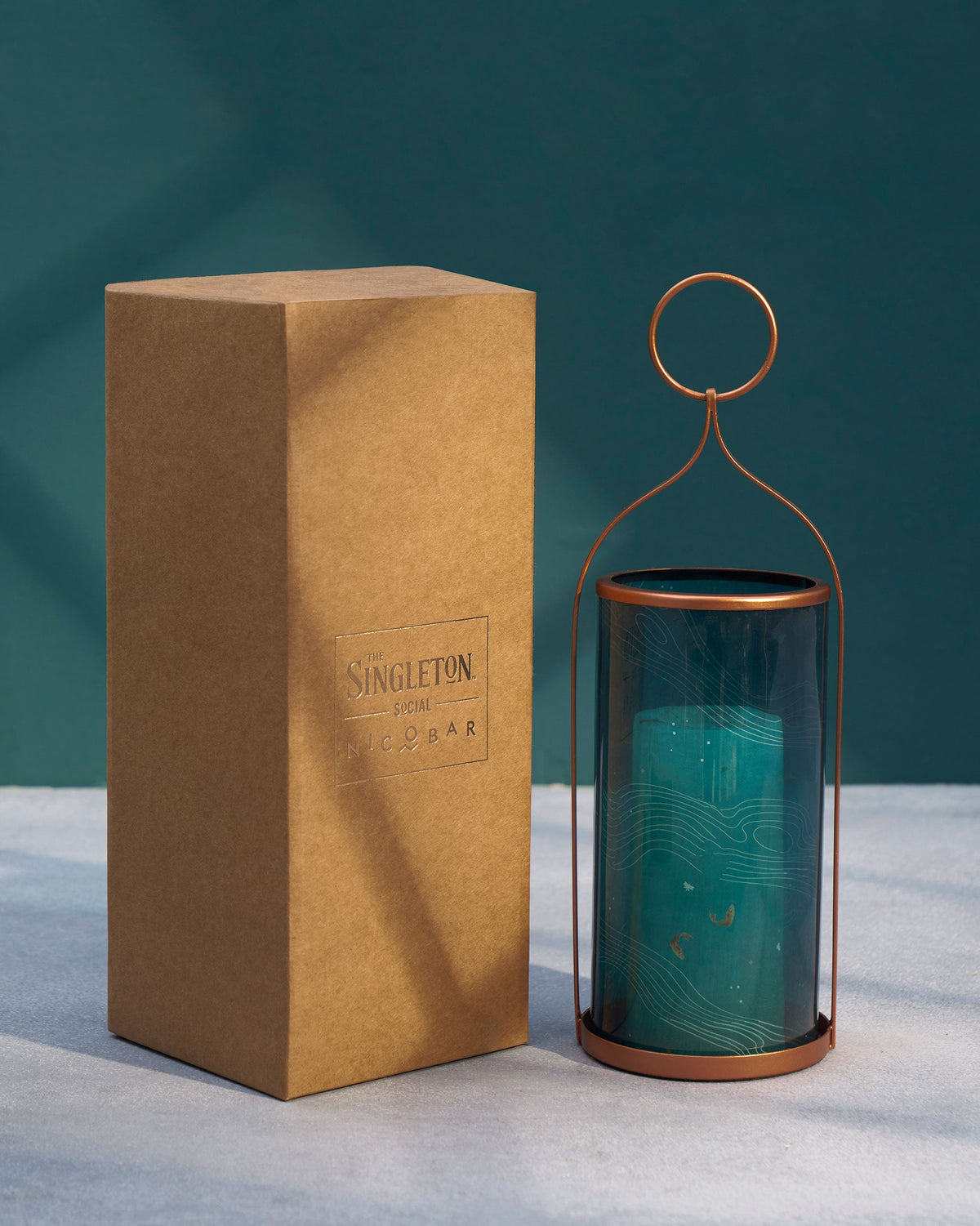 Pacific Lantern beside a tall kraft gift box.