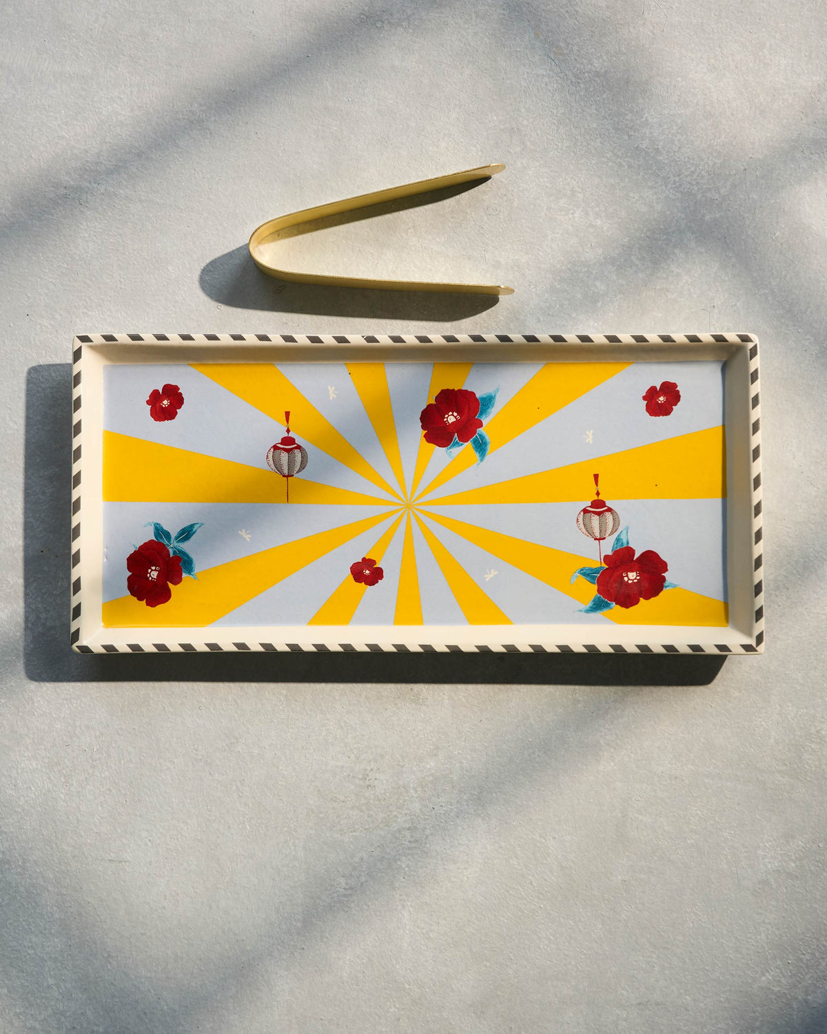 Overhead view of Chakra Cookie Tray with a gold tong.