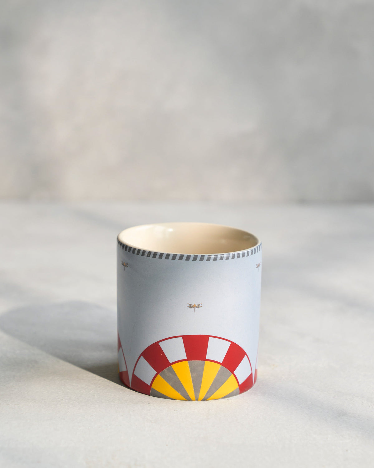 Chakra Straight Mug showing red and yellow arcs on the opposite side.