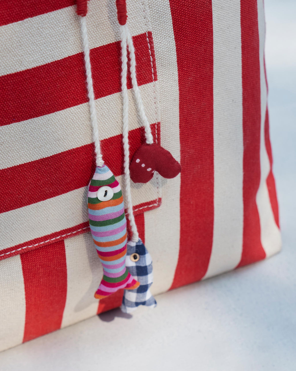 Close-up of the Bagan Stripe Tote showing its striped canvas and a hanging cord.