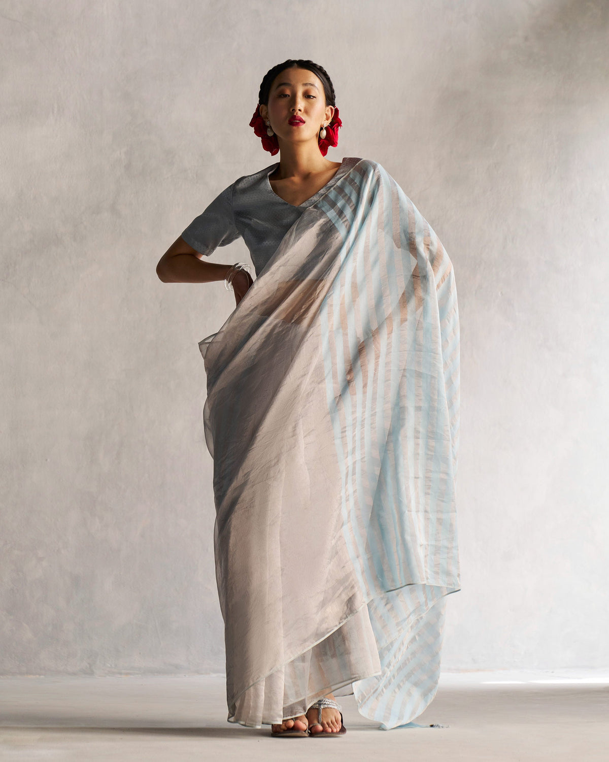 Full-length view of Zari Stripe Sari in silver and blue worn by a person.